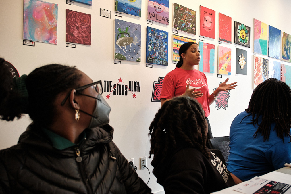 The cover image for the September 2023 Newsletter. Shows a teacher talking to a group of 3 students.