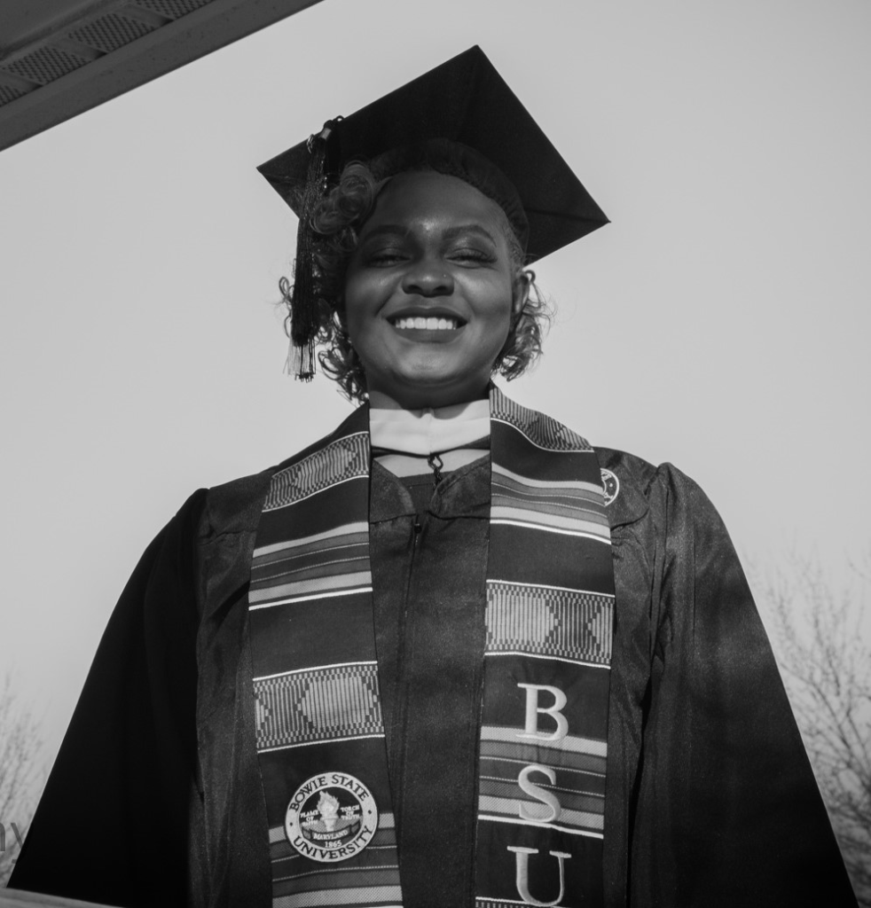 July 2024 Newsletter cover image. A black-and-white photo of a person in a academic dress.